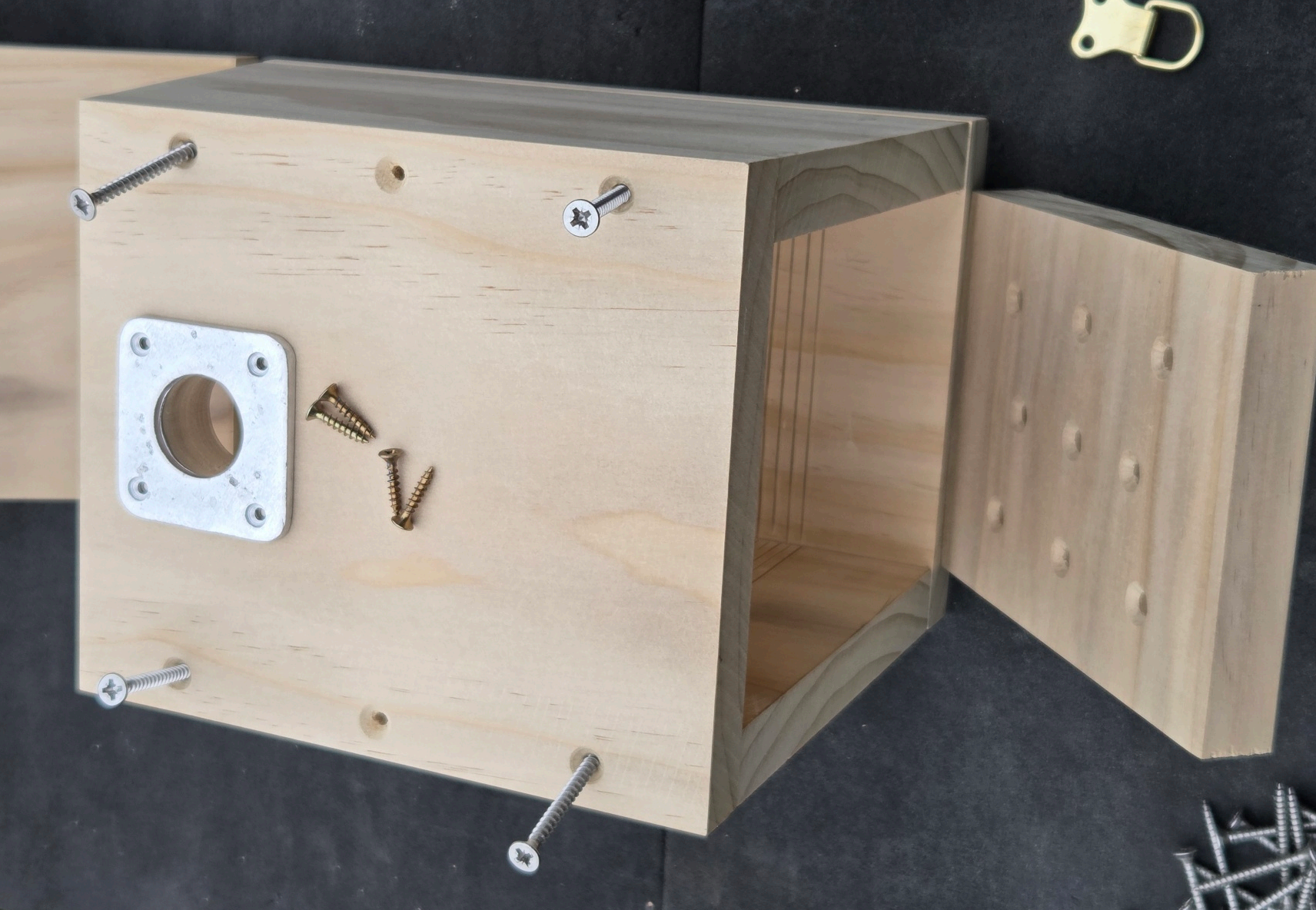 Box assembled with the metal hole-protector plate on the front and a separate roof piece beside it